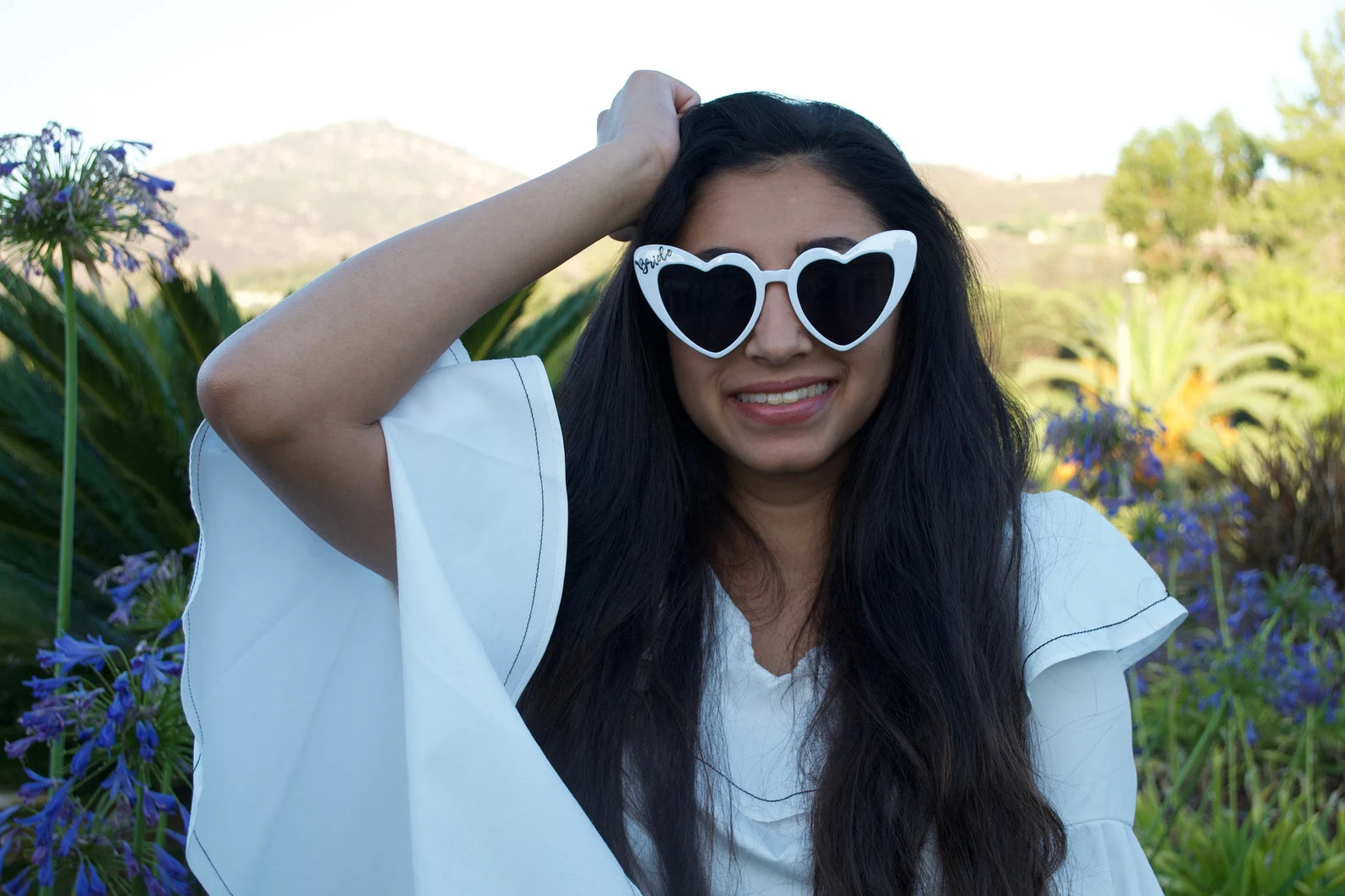 Close-up of white bride heart sunglasses