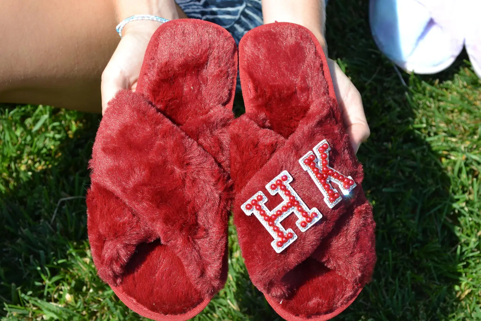 Customizable burgundy fuzzy slippers for bridesmaids and brides.